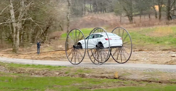 tesla-with-wagon-wheels-upside-down (1)